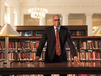 Randall Kennedy at the table where he does his research in the reading room of Harvard Law School&rsquo;s Langdell Library 