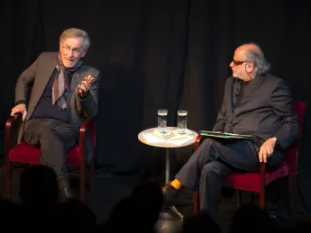 Steven Spielberg, left, converses with Mahindra Humanities Center director Homi Bhabha.