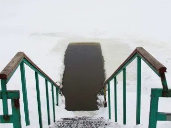 Photograph of swimming hole cut in ice
