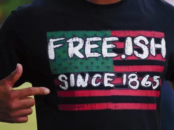 Photograph of someone wearing a Juneteenth T-shirt