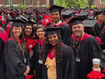 Harvard students in caps and gowns 