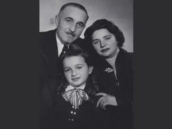 Susan Rubin Suleiman with her parents in 1949; her mother is wearing the silver pin discussed in the book excerpt.