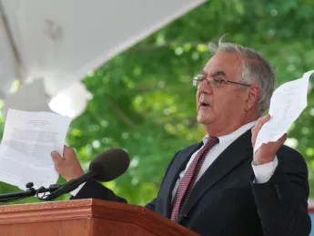 U.S. Representative Barney Frank holding up a copy of the Marshall speech from 1947.