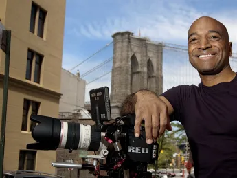 Film director Mustapha Khan near his home and studio, in the shadow of the Brooklyn Bridge 