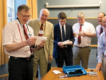 From left: David Otto, Bruce Johnson, Xandy Walsh, Alex Walsh, John Fryer, Tony Rossmann, and Paul Bamberg read letters buried in 1988. 