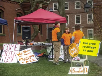 Advocates of divesting fossil-fuel investments protest at the president’s office at Massachusetts Hall.