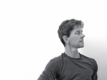 Dan Boyne demonstrates the <i>ardha matsyendrasana</i> (“half lord of the fishes”) yoga posture.
