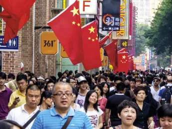 China&mdash;both a Communist Party state and a consumer society (as in this holiday street scene in Guangzhou)&mdash;is also the setting for a billion-plus citizens&rsquo; pursuit of their own dreams. 