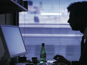 Gawande in his various environments: in his office at the Harvard School of Public Health