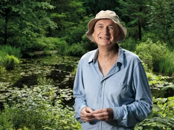 Volunteer guide Al Levin at the Lily Pond in Garden in the Woods