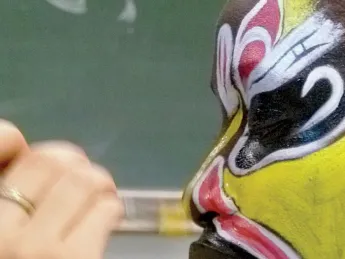 Detail of “Painting Faces of Beijing Opera,” by Christine Shen ’12, on display in lamont library