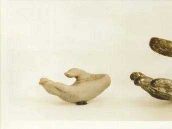Photograph (c. 1935) of a fragment from a 12th–14th century Thai bodhisattva statue, along with the plasticene copy made by a pupil at the Perkins Institute who manually explored, and then copied, the hand.