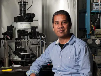 Portrait photo of Venkatesh Murthy in his laboratory