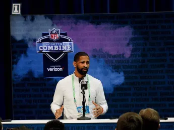Andrew Berry stands at a podium.