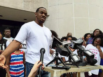 Photo of Bobby Johnson outside of Superior Court in New Haven on September 4, 2015, released from prison after nine years for a murder he did not commit