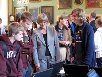 President Faust looks on as freshmen sign up for TurboVote.