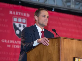 Dean James Ryan speaks to the more than 1,300 attendees at the HGSE campaign launch, held under a tent in Radcliffe Yard.