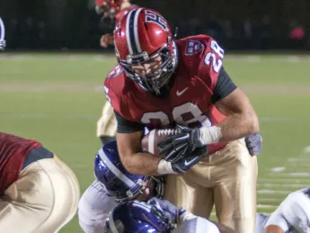 Only 4:09 minutes into the game, surprise Crimson starter Andrew Casten scored the season's first points--and the first of his three touchdowns—on a three-yard plunge. Casten averaged nine yards a carry.