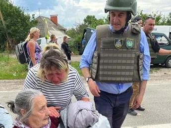 Newmark with an elderly Ukrainian woman
