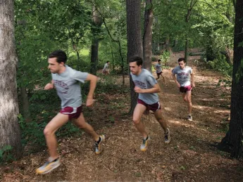 Cross-country captain Daniel Chenoweth  running hill repeats at Fresh Pond 