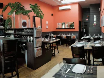 Among Vee Vee’s charms are its boldly colored walls (Benjamin Moore’s “Autumn Cover”), a signature touch for co-owner Kristen Valachovic, an interior designer before restaurant life took hold.  