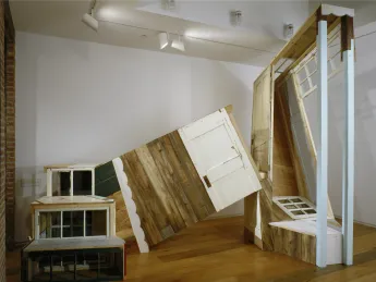Meredith James created her 14 x 8 x 12-foot sculpture <i>Impossible House</i> with salvaged wood and windows.