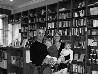 Happily at home: Brian Buckley, Katherine Hunter, and their children in the family’s poetry bookstore in Boulder.