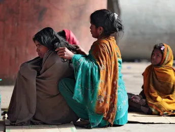 Many families make their homes on sidewalks near the train station in Jaipur, India.