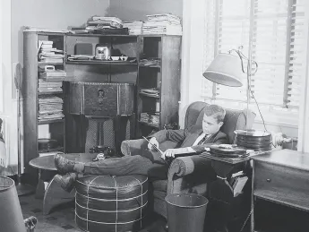 A 1940s undergraduate listens to records in his suite. 