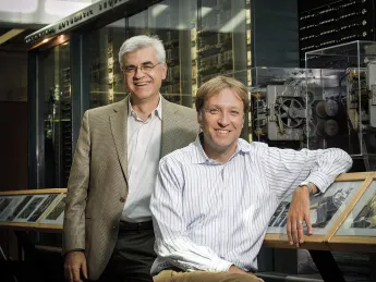 Efthimios Kaxiras (left) and Hanspeter Pfister in front of a portion of Howard Aiken&rsquo;s Mark I computing machine 