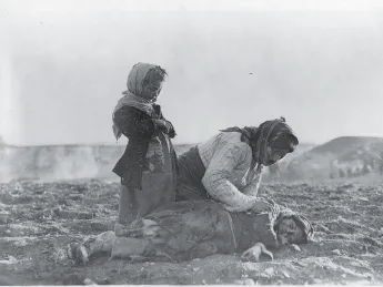 The endless pain of the Middle East: woman and dead child near Aleppo, Syria (undated)