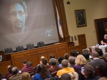 The scene in Ames Courtroom as Lawrence Lessig spoke with Edward Snowden