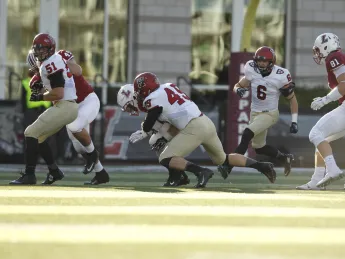 Harvard senior linebacker Eric Medes (49) had a team-high seven tackles and a sack of Leopard quarterback Drew Reed.