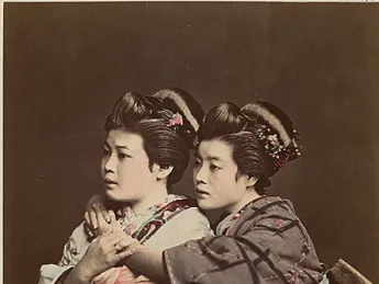 1870s Japan: a hand-tinted albumen print by Raimund von Stillfried showing two women posing