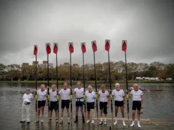 Oars raised after the race: (from left) Hugh Crane, Garrett Olmsted, Gib Vincent, Roger Cheever, Scott Steketee, Phil Tonks, Bobby Baker, Bill Endicott, and Gerry Goulet.