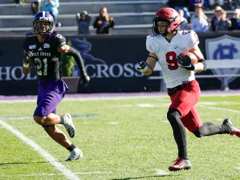 Harvard senior Cody Chrest runs with ball in hand