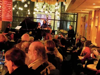 The Mad Monkfish's stage viewed from the back of a room