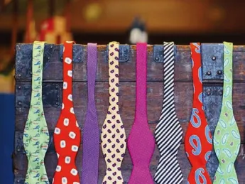 A display rack holding colorful men’s bow ties