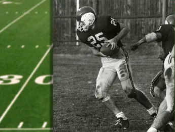 Ric Zimmerman leans forward with football in hand