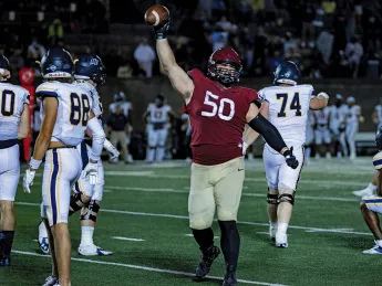 Defensive lineman Thor Griffith, a junior, celebrating  two sacks and a game-high nine tackles against Merrimack