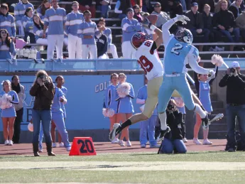 Receiver Chris Lorditch outjumped Columbia cornerback Brian DeVeau to snare a pass from quarterback Collier Winters in the third period of Saturday's game at Wien Stadium. Dodging two more Lion defenders, Lorditch dove into the end zone for a 41-yard touchdown, Harvard's fourth of the afternoon.