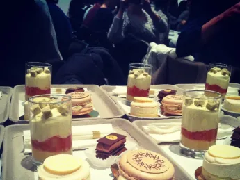 The four desserts—a lemon cake, a macaron, yuzu wasabi gelée with fresh grapefruit confit and mascarpone cream, and a milk-chocolate-and-hazelnut treat