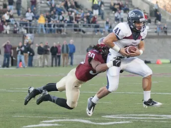 In the final minute of play, safety Jaron Wilson stopped Penn halfback Kyle Wilcox at the Harvard 20-yard line after a one-yard gain on a swing pass. Holding off three final passing attempts, the Crimson defense quashed the Quakers’ late bid for a game-tying rally.  