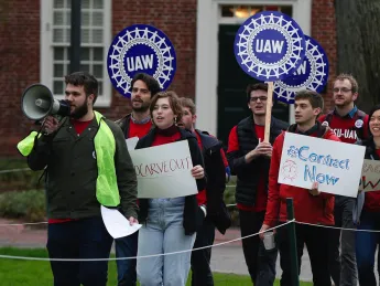 Union protesters march at Harvard University in Cambridge, Mass., Wednesday, May 1, 2019.