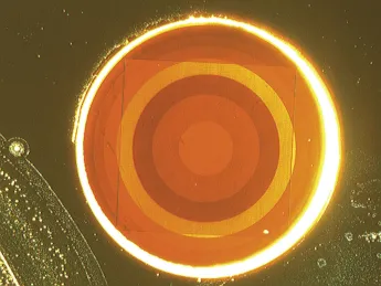 This disortion-free flat lens, less than a millimeter across, uses antennae etched from a layer of gold, rather than glass, to focus laser light. 
