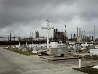 Old and new along the Mississippi: Holy Rosary Cemetery and Dow Chemical Corporation, Taft, Louisiana, 1998. From <i>Petrochemical America</i> 