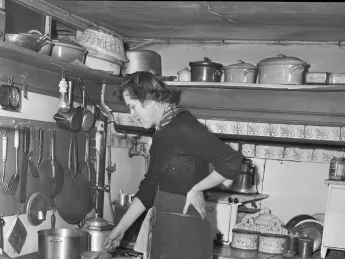 Child in her postwar Paris kitchen