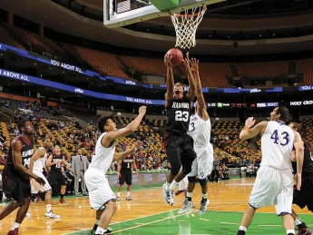 Senior Wesley Saunders, easing in for a layup in the early- season loss to Holy Cross, led Harvard in scoring through the first six games, averaging 20.2 points per game.