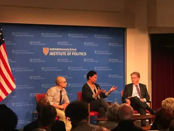 The three panelists on stage at the Kennedy School.