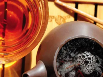 Photo of a steaming pot to tea